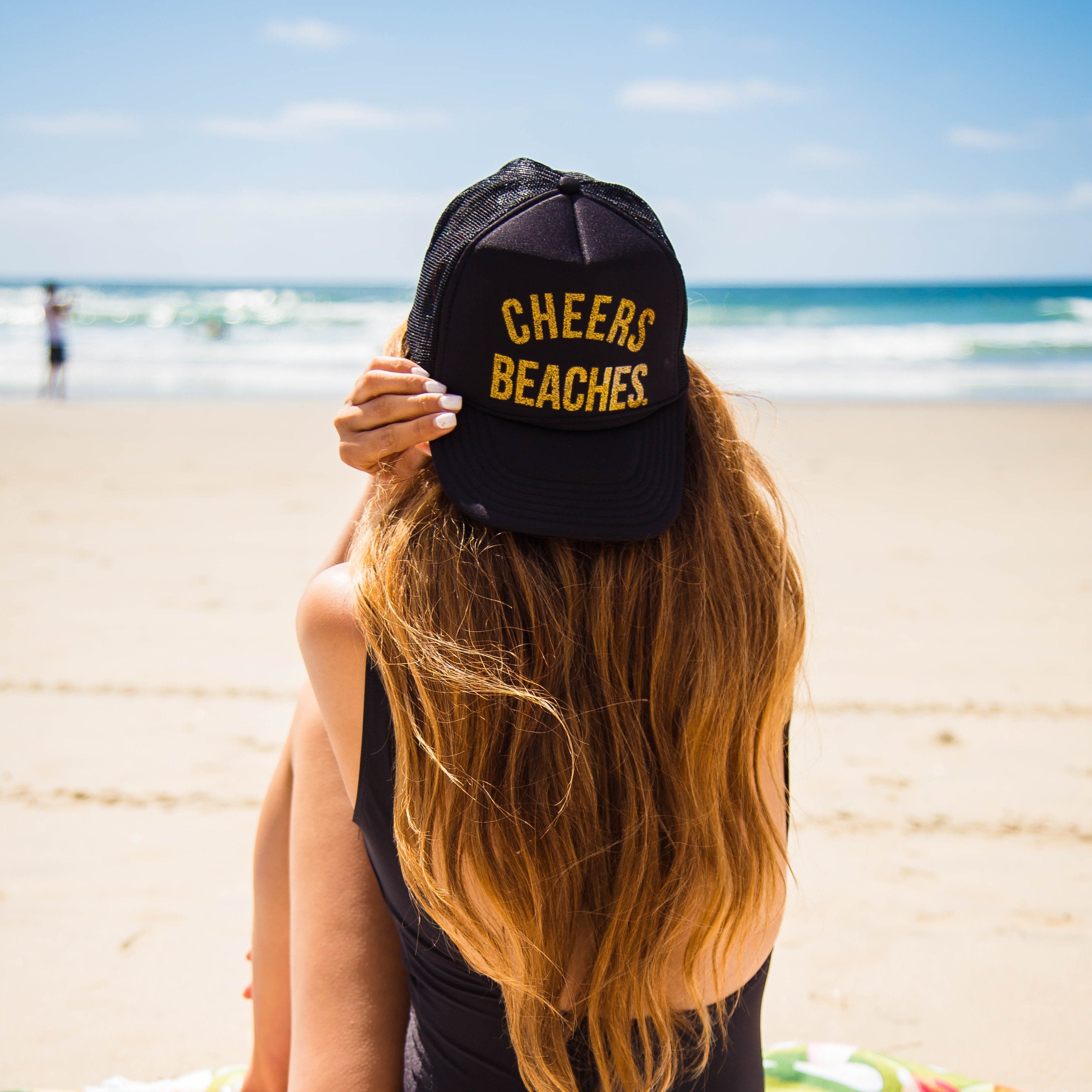 https://www.cheersbeaches.com/cdn/shop/products/cheers-beaches-accessories-black-and-gold-cheers-beaches-trucker-hat-black-glitter-gold-28041994993743_3362x.jpg?v=1617929471